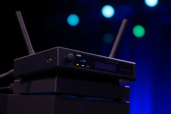 Optimizing Your Setup with PG88 Wireless Microphone Systems for Clear Sound High-resolution image of the PG88 wireless receiver with signal indicators, showcasing its professional audio equipment design for stage use.